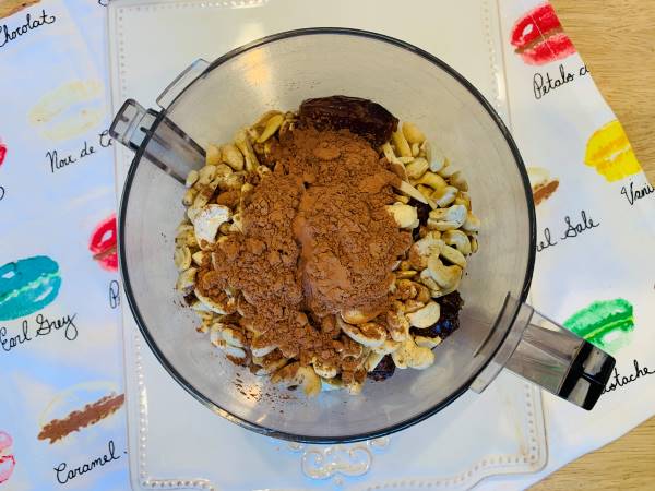 ingredients for date filled chocolate truffles inside a food processor