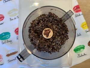Ingredients for date filled chocolate truffles in a food processor, blended