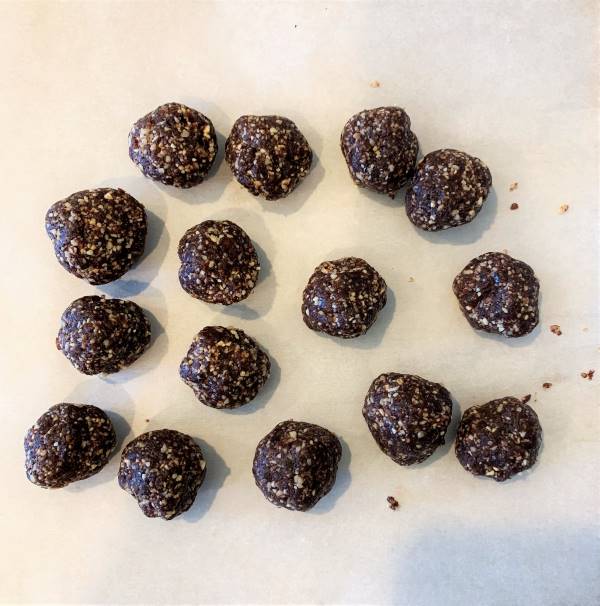 baking sheet filled with date balls before being dipped in chocolate
